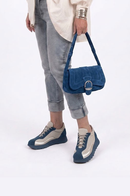 Dress sneakers in peacock blue and silver leather with thick rubber soles and round toe - Worn view